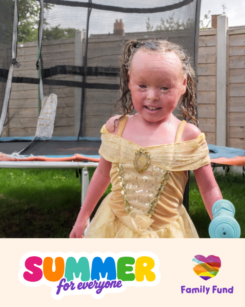 A young girl in a yellow princess dress looks at the camera smiling in her garden. A banner at the bottom has two logos that say 'Summer for everyone' and 'Family Fund'