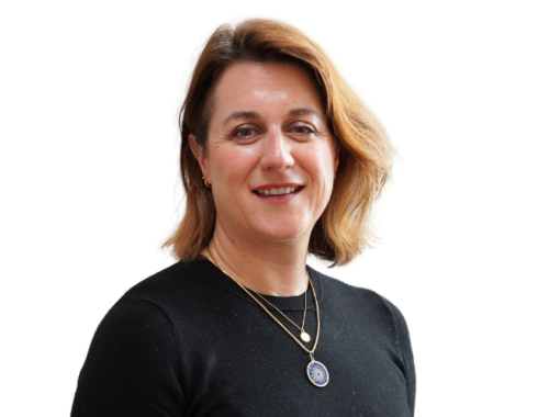 A woman wearing a black top, is smiling