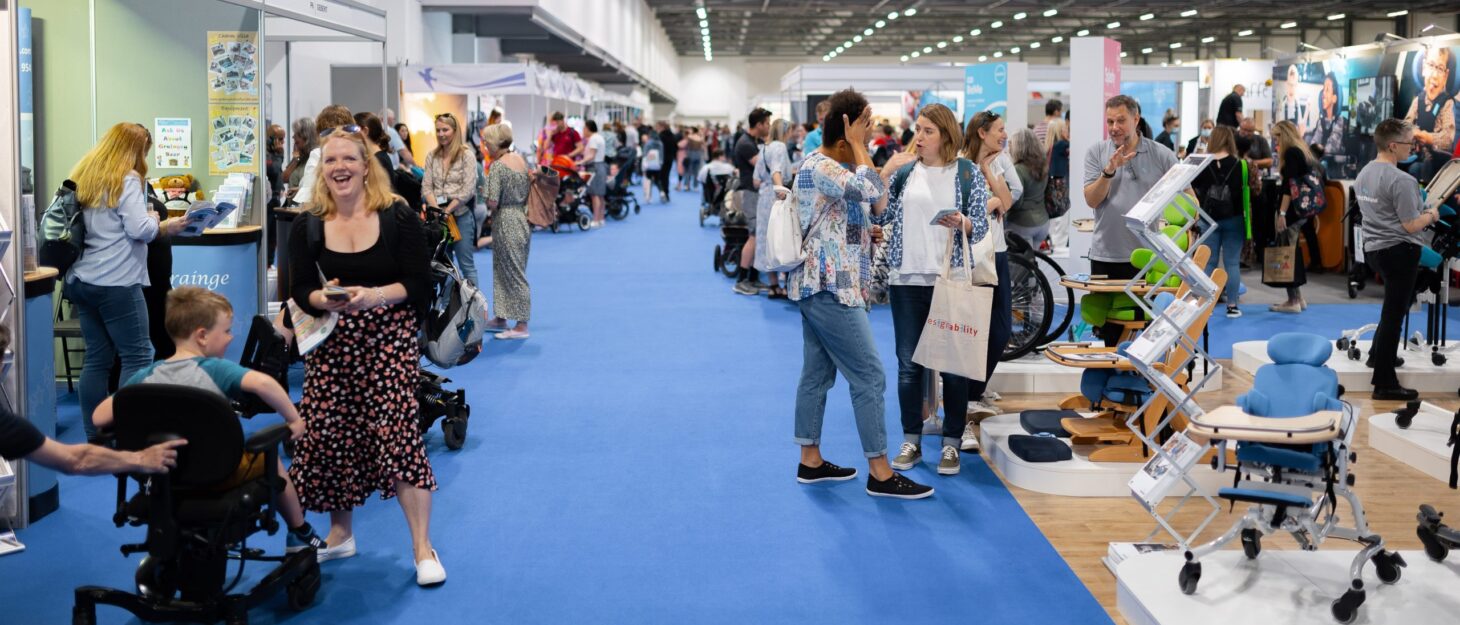 A group of people wandering around the Kidz to Adultz exhibition hall