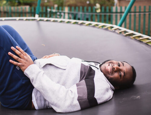 a boy on a trampoline