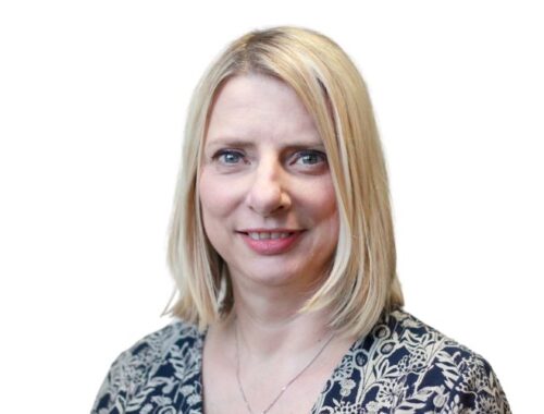 A woman with short blonde hair