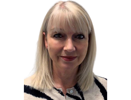 a blonde woman looking at the camera