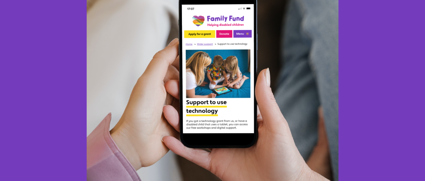 Woman holds iPhone in her hands which shows Family Fund's digital skills support pages